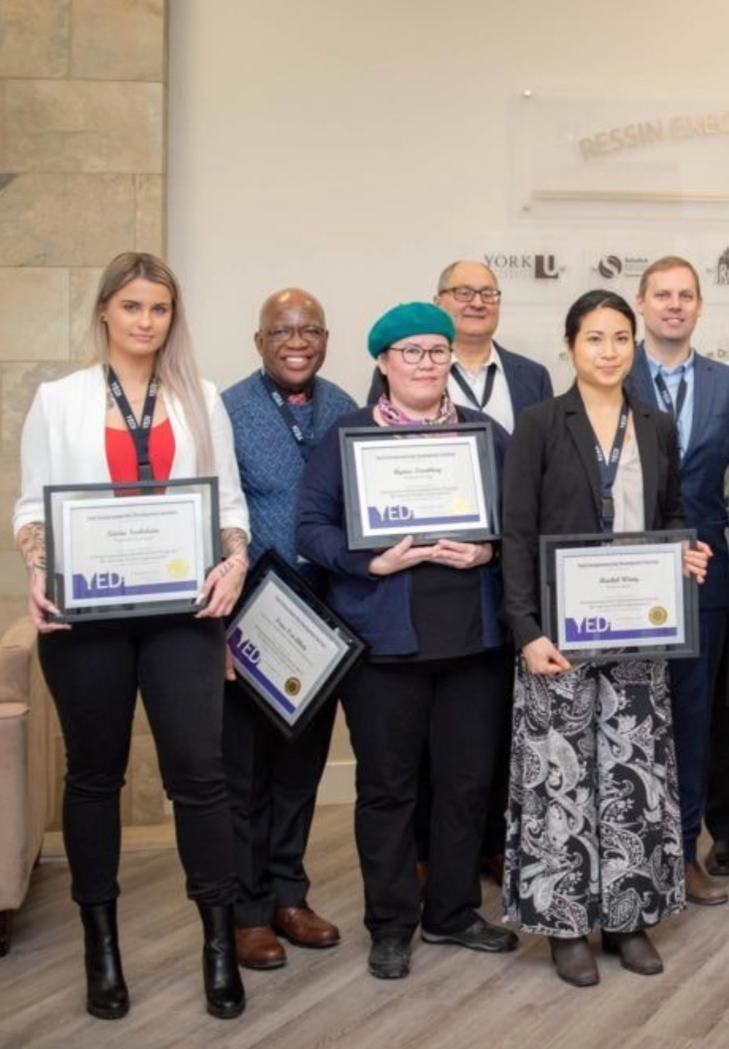 Photo of YEDI graduates proudly holding their certificates after completing the entrepreneurship program