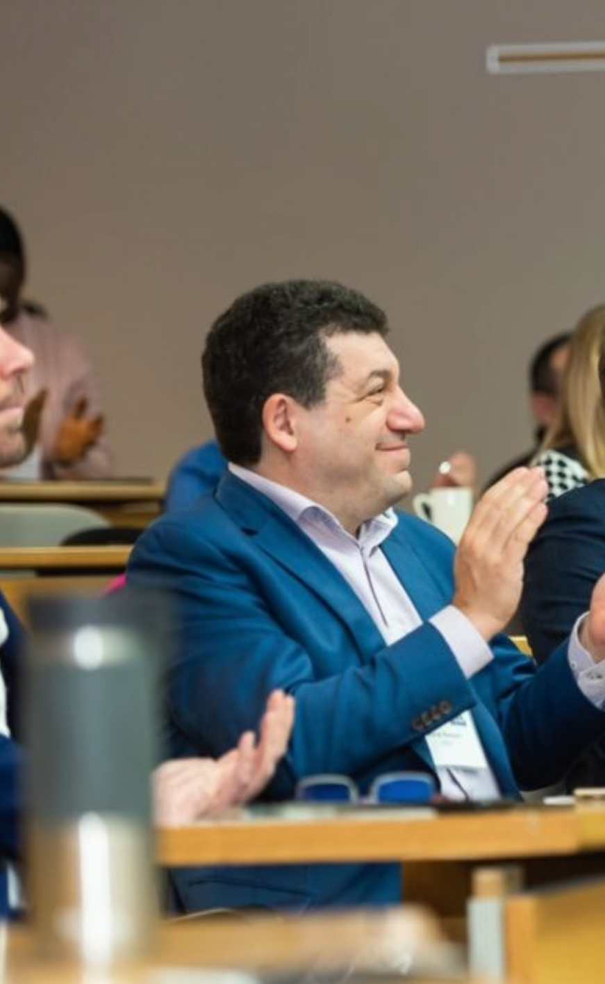 Photo of YEDI International Program session with participants listening to a lecture and applauding